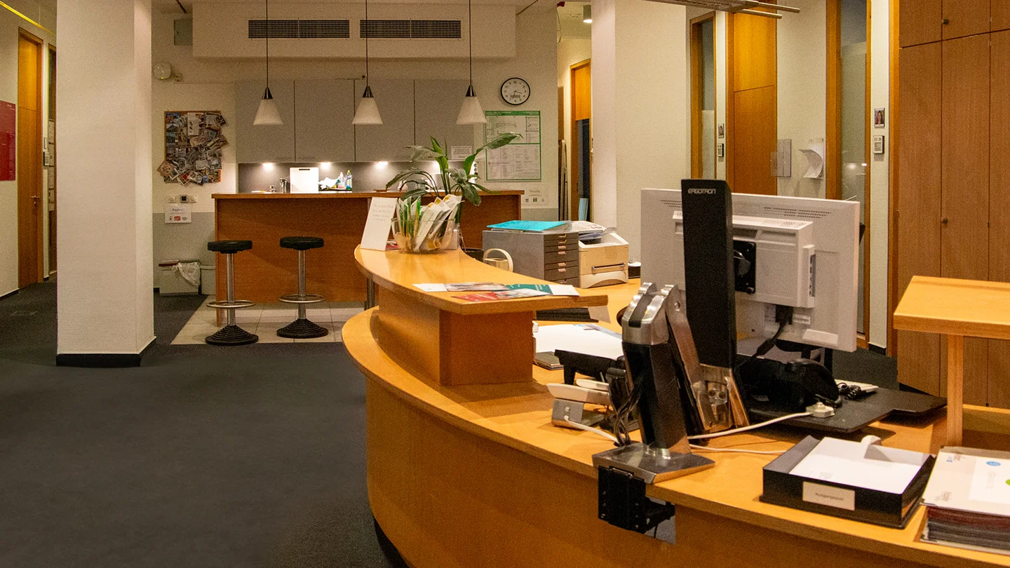 Reception area of the MPI MiS with reception desk and computer