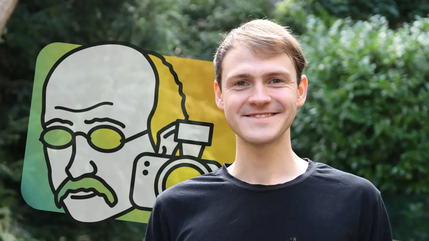 Portrait of Mikhail Glazkov outside in front of green plants and the Math Planck People logo